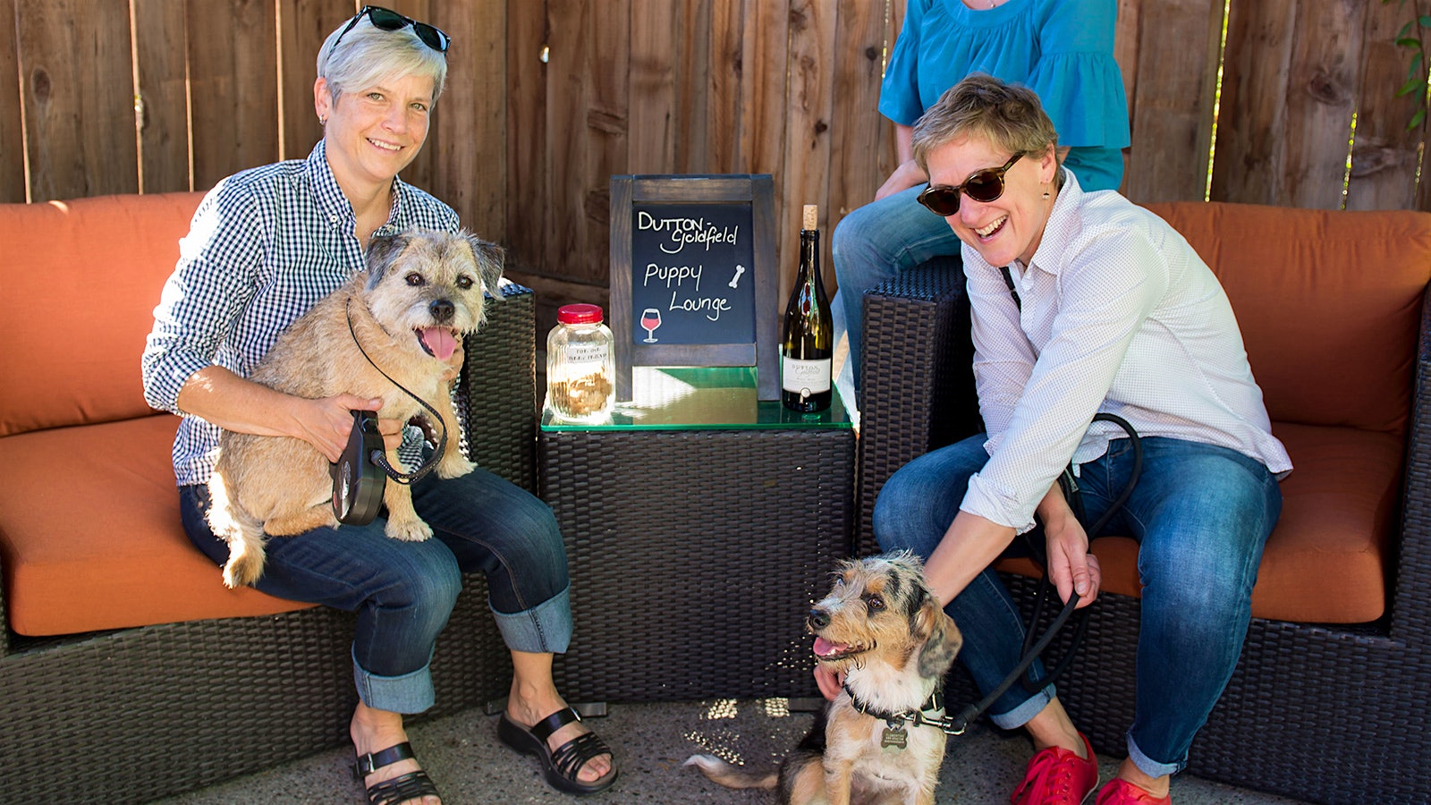 Wine lovers and their dogs visit the Dutton-Goldfield tasting room puppy lounge in Sonoma County